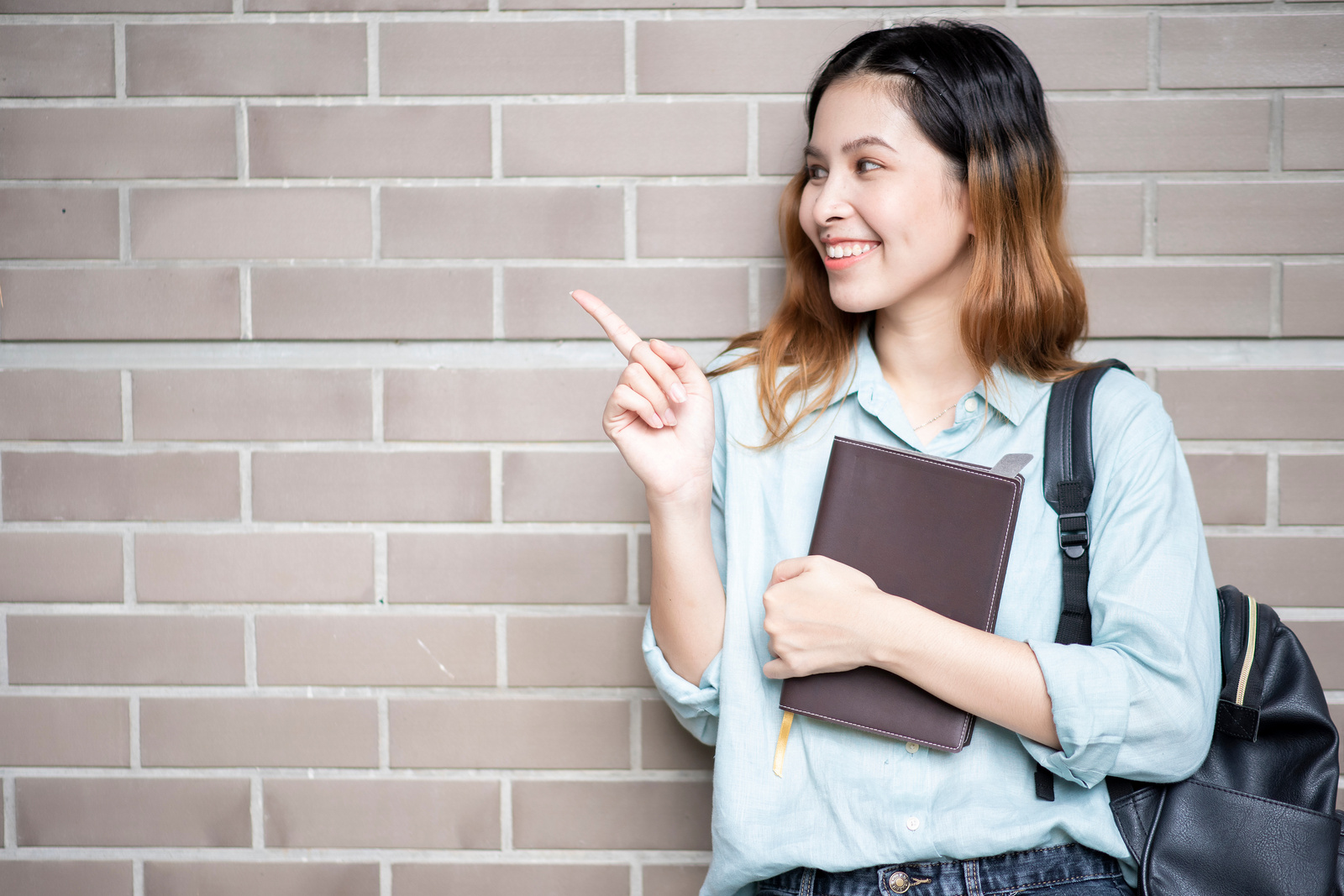 Happy young Asian University student.