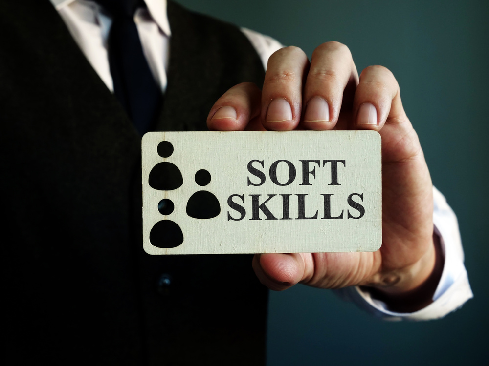 Soft skills sign in the hands of a man.