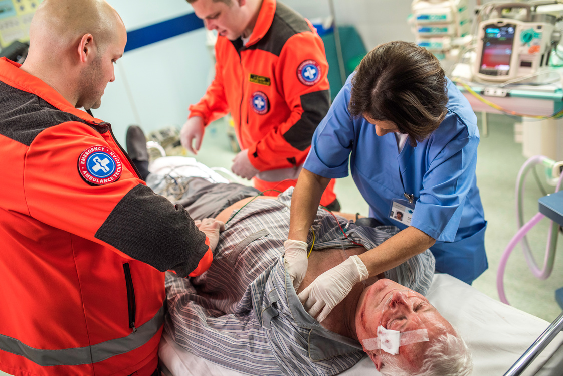 Paramedics and nurse in emergency room